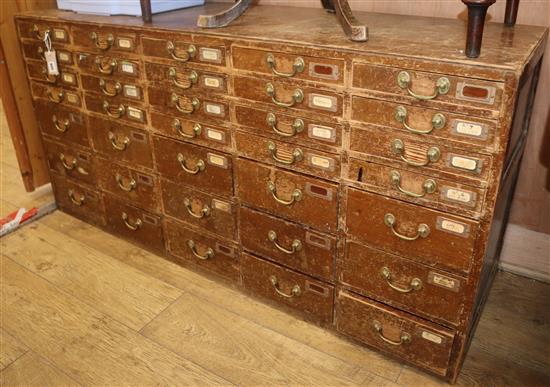 An early 20th century pine 35 drawer filing chest W.150cm